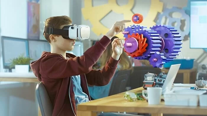 a child wearing a VR headset whilst working on a puzzle involving cogs